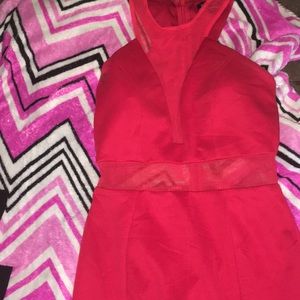 An All Red Dress With A Mesh Cut Out Top